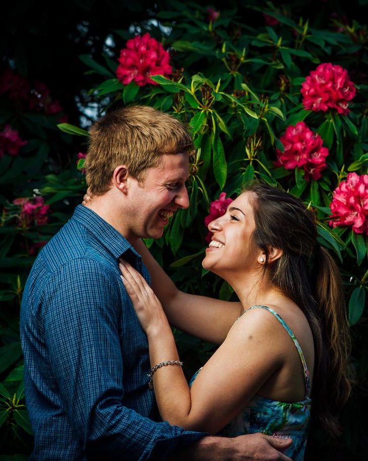 A couple's portrait displayed near a bedroom doorway in soft natural light