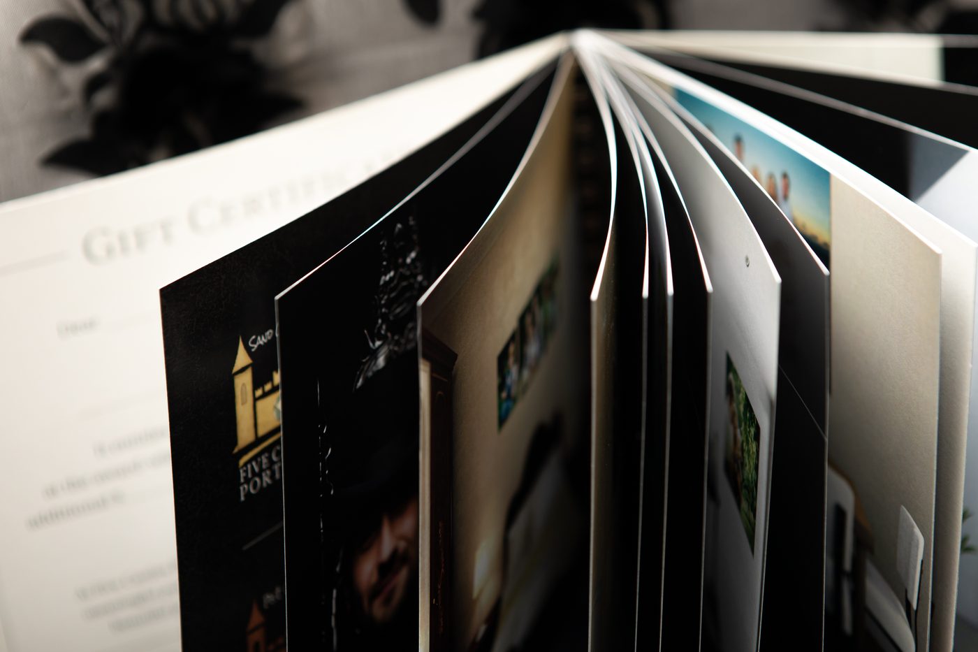 A Keepsake Art Album shown open, mid page-turn