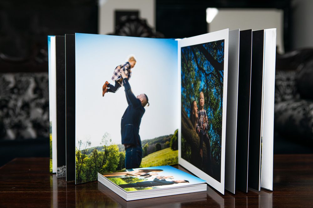 A Keepsake Art Album shown open, mid page-turn