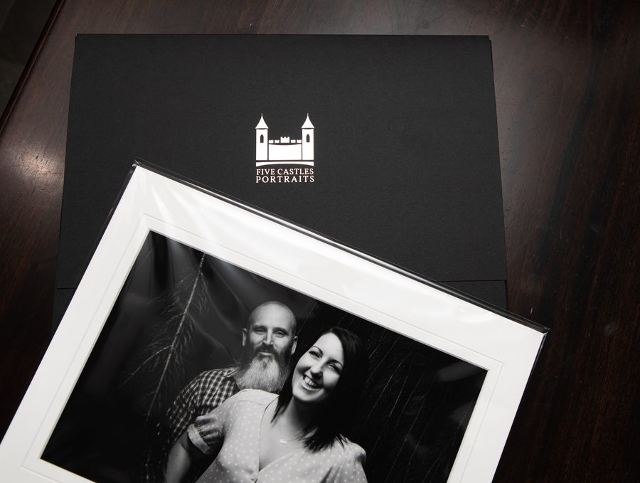An open folio box with a matted portrait