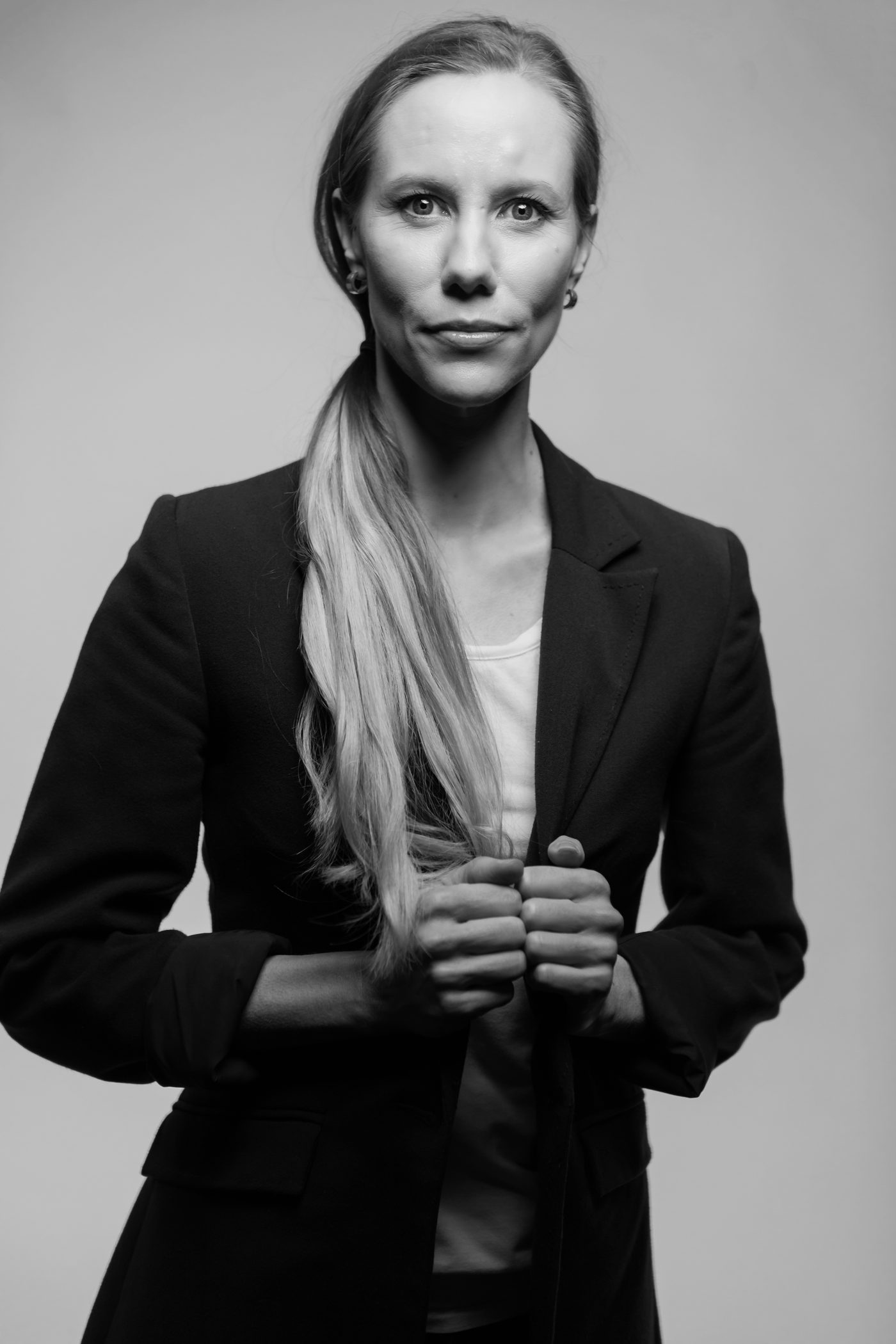 A monochrome personal branding portrait in a black blazer, timeless and strong